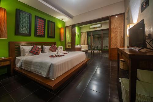 Postel nebo postele na pokoji v ubytování Gaing Mas Jimbaran Villas by Gaing Mas Group