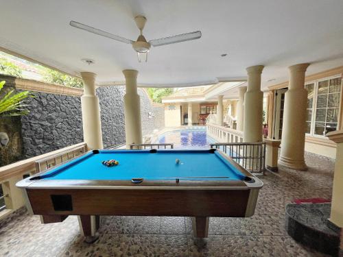a pool table in the middle of a house at Vila Princess Sentul Privatepool 6 bedroom,5bathroom, Tenis meja, billiard in Gadok 1