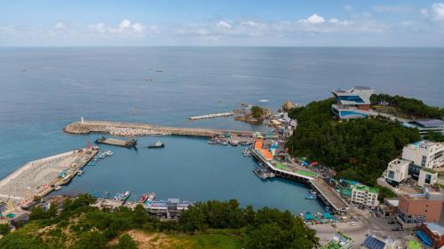 an aerial view of a marina with a dock at Samcheok sky Pension in Samcheok