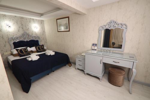 Postel nebo postele na pokoji v ubytování BALPETEK HOTEL