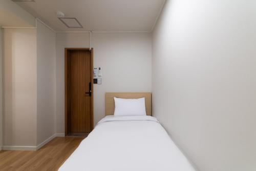 Cama o camas de una habitación en ZIYOLK Myeongdong