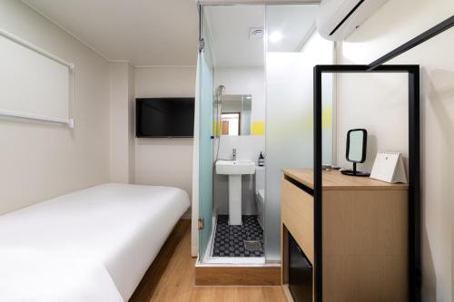 Cama o camas de una habitación en ZIYOLK Myeongdong
