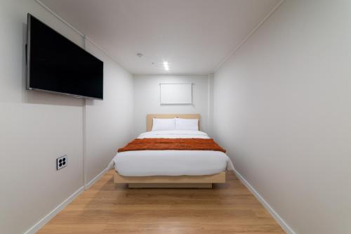Cama o camas de una habitación en ZIYOLK Myeongdong