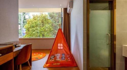 a toy pyramid sitting on the floor of a room at James Joyce Coffetel·Lijiang Old Town Centeral in Lijiang