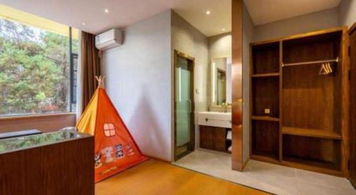 a bathroom with a sink and a red tent in it at James Joyce Coffetel·Lijiang Old Town Centeral in Lijiang