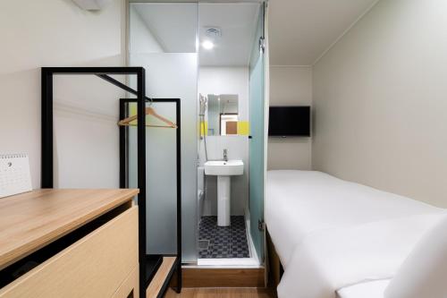 Cama o camas de una habitación en ZIYOLK Myeongdong