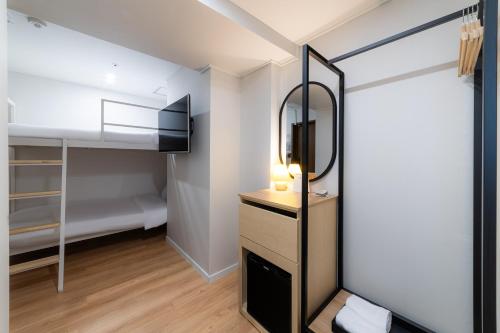 Cama o camas de una habitación en ZIYOLK Myeongdong