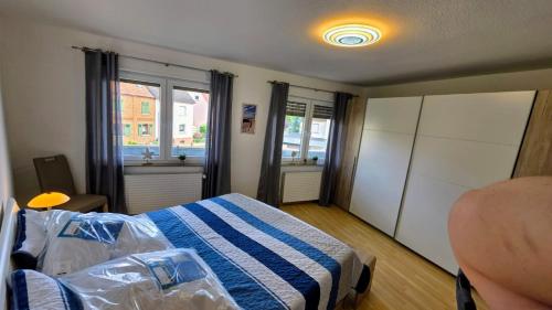 a small bedroom with a bed and a window at Perfect Living in Petersberg