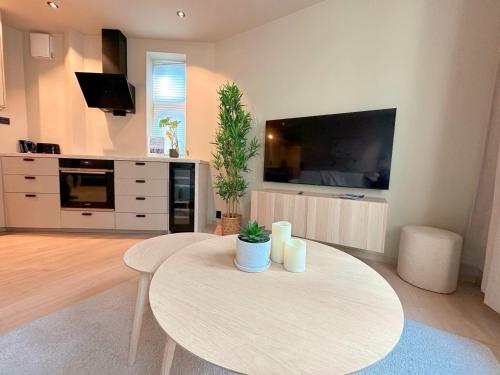 Μια τηλεόραση ή/και κέντρο ψυχαγωγίας στο Bergen City Apartment