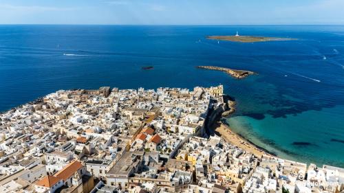 an aerial view of a city and the ocean at Palazzo Celina in Gallipoli