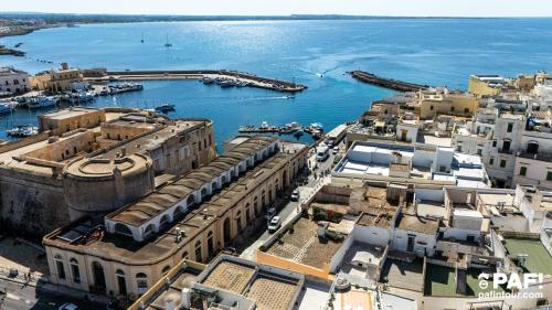 an aerial view of a city with a harbor at Palazzo Celina in Gallipoli
