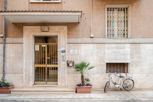 a bike parked in front of a building at Interamna House, intero appartamento exclusive use in Terni