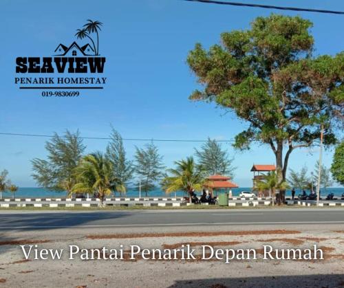 a view of a road in front of the ocean at SeaView Homestay in Kampong Ru Sepuloh