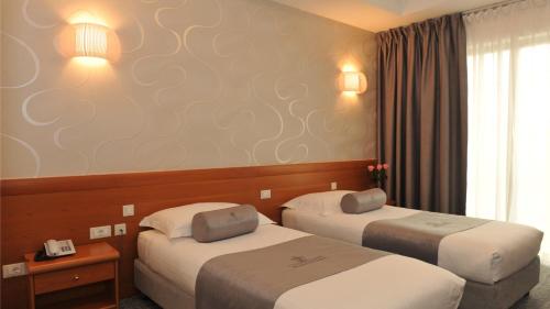 Una cama o camas en una habitación de Hotel Venko