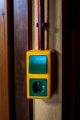a cat outlet on a wall with a cat inside at Kleio in Elatochori