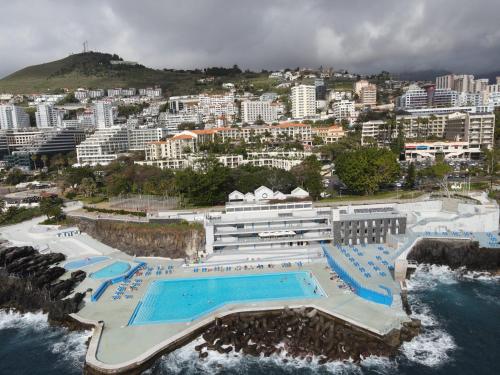 an aerial view of a resort with a large swimming pool at Sea and Sun 4 You - Villa Oliveira in Funchal