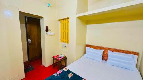 Postel nebo postele na pokoji v ubytování Hotel Panthapath Near Square Hospital