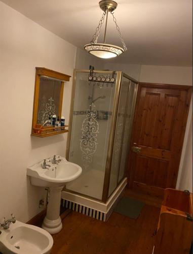 a bathroom with a sink and a shower and a toilet at Room Stay 2 