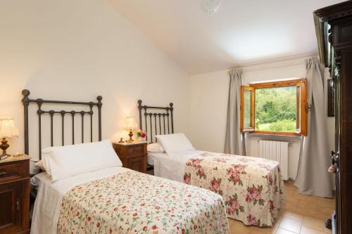 Ένα ή περισσότερα κρεβάτια σε δωμάτιο στο Villa Fornaci