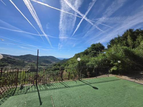 a tennis court with a net on top of it at Eucalipto - By Ligooria in Magliolo