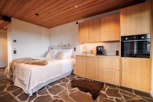 Ένα ή περισσότερα κρεβάτια σε δωμάτιο στο Hideout Villas - Kide Lodge
