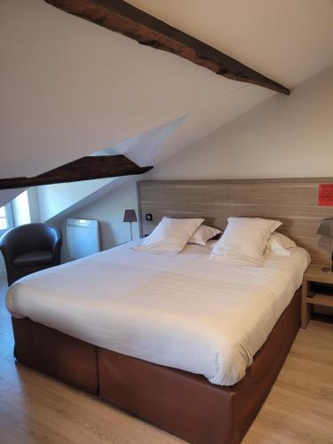 Postel nebo postele na pokoji v ubytování L'Hotellerie de la Toile à Beurre