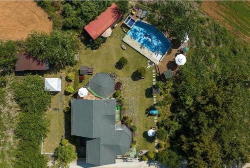 an overhead view of a yard with a swimming pool at Nobless Pension in Taean