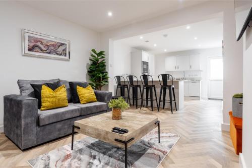 a living room with a couch and a table at Riverside Work-Stay Free Dedicated Parking in Warrington