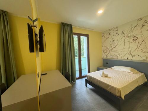 Ένα ή περισσότερα κρεβάτια σε δωμάτιο στο Hotel Sala Ricevimenti Piccolo Paradiso