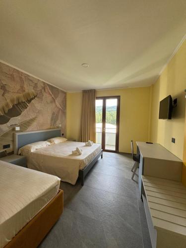 Ένα ή περισσότερα κρεβάτια σε δωμάτιο στο Hotel Sala Ricevimenti Piccolo Paradiso