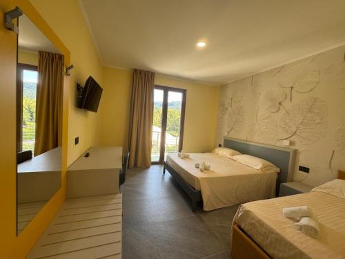 Ένα ή περισσότερα κρεβάτια σε δωμάτιο στο Hotel Sala Ricevimenti Piccolo Paradiso