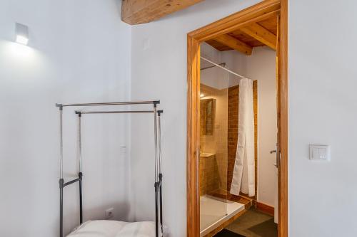 a bathroom with a shower and a glass door at A ver Lisboa 3 in Porto Brandão