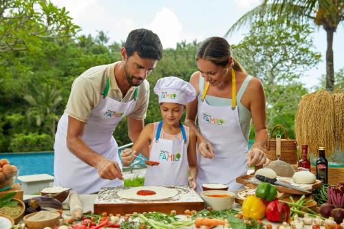 a family preparing food on a table at The Westin Resort & Spa Ubud, Bali in Ubud
