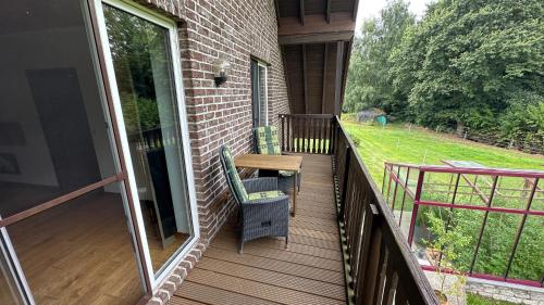 a balcony with a table and chairs on it at Apartments Mester in Xanten