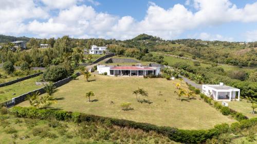 an aerial view of a house with a large yard at Villa Charlotte in Port Mathurin