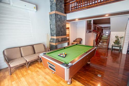a living room with a pool table and a couch at Triple Trees A15 House Khao Yai in Mu Si