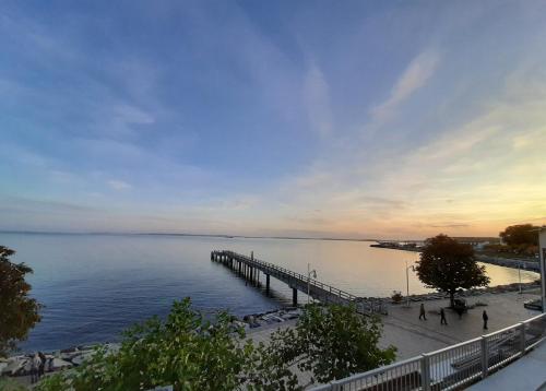 a pier stretches out over a body of water at Fürstenhof Sassnitz - PANORAMA103 in Sassnitz