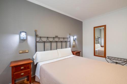 Un ou plusieurs lits dans un hébergement de l'établissement Hostal La Posada