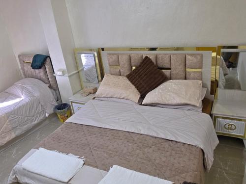 Postel nebo postele na pokoji v ubytování hostel ـ Karak dream