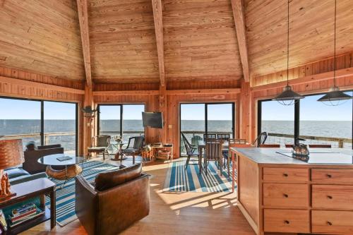 a living room with a view of the ocean at Rustic Retreat in Ocean Springs