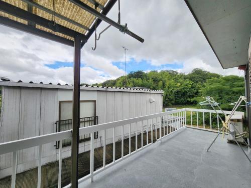 a view from the balcony of a house at まんのう清流庵 in Manno