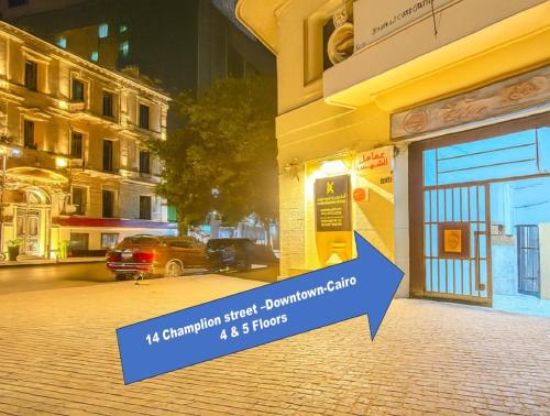 a sign in front of a building with a car parked outside at Cairo Dream Boutique Hotel in Cairo