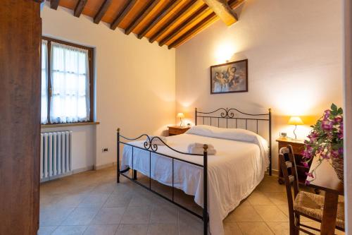 Ένα ή περισσότερα κρεβάτια σε δωμάτιο στο Borgo San Carlo