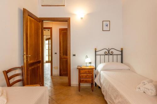 Ένα ή περισσότερα κρεβάτια σε δωμάτιο στο Borgo San Carlo
