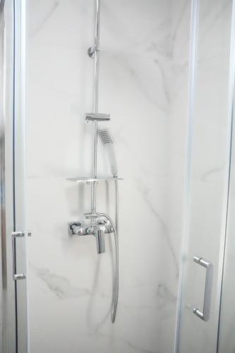 a shower with a faucet in a bathroom at Aeri Nature Concept in Baljevac