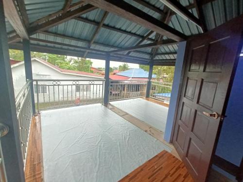 a view from the inside of a screened in porch at Teratak Taha in Kepala Batas