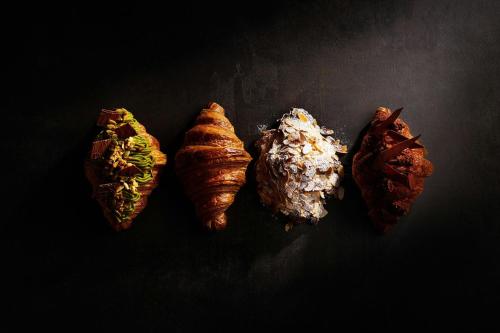 four different types of food on a black surface at JW Marriott Hotel Tokyo in Tokyo