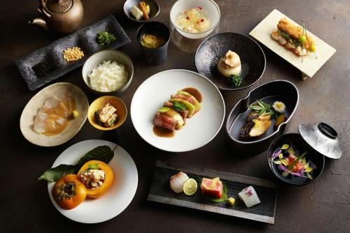 a group of plates of food on a table at JW Marriott Hotel Tokyo in Tokyo