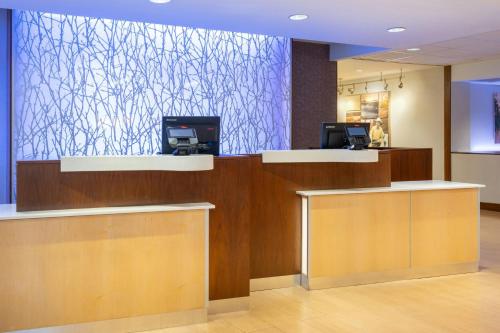 a lobby with a reception desk with a large wall at Fairfield Inn & Suites by Marriott Towanda Wysox in Towanda
