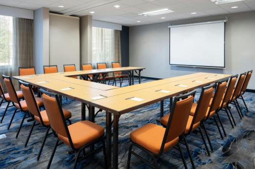 a conference room with a long table and chairs and a whiteboard at Fairfield Inn & Suites by Marriott Towanda Wysox in Towanda